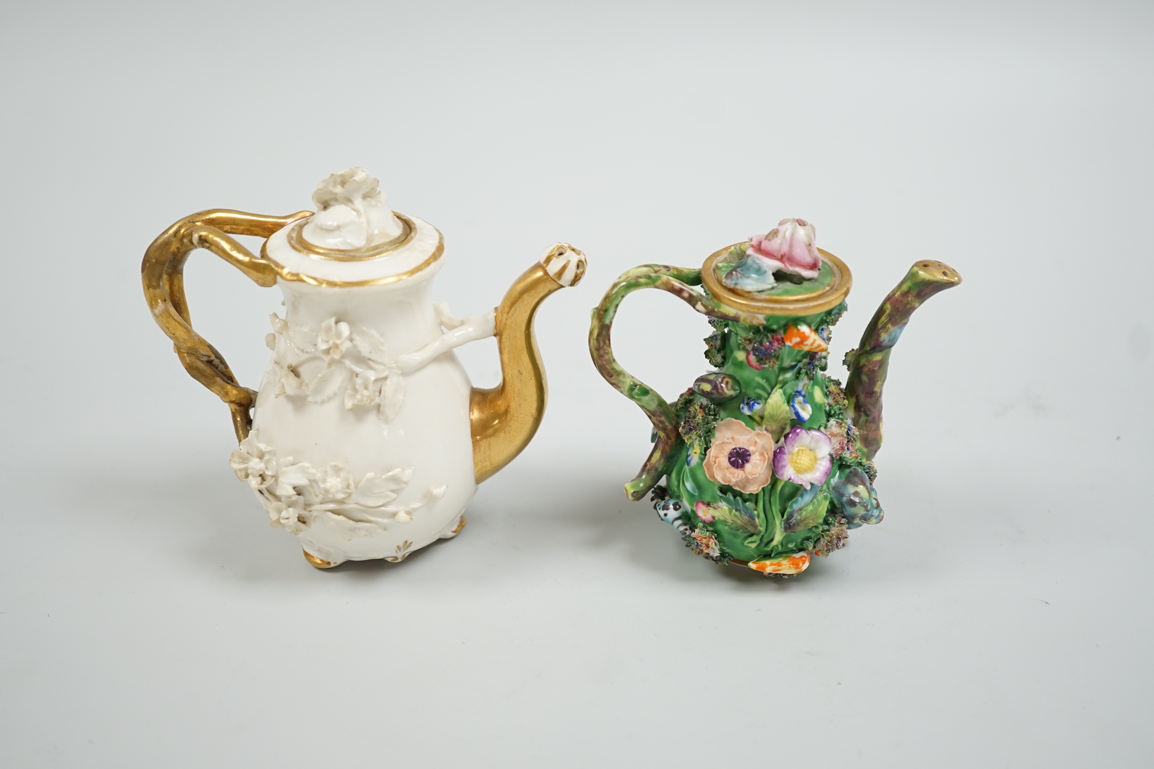 Toy porcelain. A Rockingham flower encrusted rosewater sprinkler and an English porcelain flower encrusted rosewater sprinkler, probably Spode, c.1830, the former with gilt model no. ‘C1’, tallest 10.5cm high